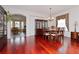 Formal dining room with hardwood floors and elegant chandelier at 4224 Fleewell Ct, Valrico, FL 33596