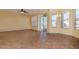 Gathering room with tile floors and access to the backyard at 4224 Fleewell Ct, Valrico, FL 33596