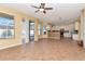 Gathering room with tile floors and view into kitchen at 4224 Fleewell Ct, Valrico, FL 33596