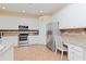 Kitchen with granite countertops, stainless steel appliances, and white cabinets at 4224 Fleewell Ct, Valrico, FL 33596