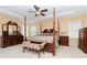 Main bedroom with a large four poster bed and plenty of space at 4224 Fleewell Ct, Valrico, FL 33596