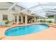 Relaxing pool and spa with covered patio at 4224 Fleewell Ct, Valrico, FL 33596