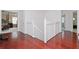 Upstairs hallway with hardwood floors and access to bedrooms at 4224 Fleewell Ct, Valrico, FL 33596