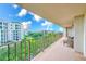 Spacious balcony with wicker furniture and scenic water views at 220 Belleview Blvd # 802, Belleair, FL 33756