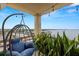 Serene balcony with stunning water views and a hanging chair at 5700 Mariner St # 801E, Tampa, FL 33609