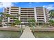 Building exterior showcasing water access and landscaping at 5700 Mariner St # 801E, Tampa, FL 33609