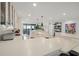 Modern kitchen with white cabinetry and large island at 5700 Mariner St # 801E, Tampa, FL 33609