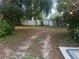 Large backyard with mature trees and privacy fence at 1111 67Th Nw St, Bradenton, FL 34209