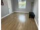 Bright bedroom with wood-look floors, window, and neutral walls at 1111 67Th Nw St, Bradenton, FL 34209