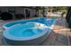 Enclosed pool and spa with patio and seating at 1111 67Th Nw St, Bradenton, FL 34209