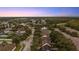 Aerial view of neighborhood, showcasing street layout and homes at 2944 Prairie Iris Dr, Land O Lakes, FL 34638