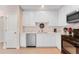 Clean kitchen featuring white cabinets and black appliances at 2944 Prairie Iris Dr, Land O Lakes, FL 34638