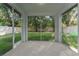 Peaceful screened porch overlooking the backyard at 2944 Prairie Iris Dr, Land O Lakes, FL 34638