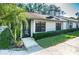 Front view of a single story house with a screened porch at 3508 Magnolia Ridge Cir # 301, Palm Harbor, FL 34684