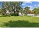 Large backyard with playground and lush landscaping at 13606 Pub Pl, Tampa, FL 33618