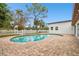 Kidney-shaped pool with brick patio and fenced yard at 13606 Pub Pl, Tampa, FL 33618