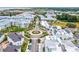 Aerial view of a coastal community featuring a roundabout and modern architecture at 5310 Escena Ct, Tampa, FL 33611