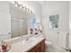 Clean bathroom with single sink vanity and a shower/tub combo at 5310 Escena Ct, Tampa, FL 33611