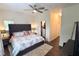 Primary bedroom with king bed, walk-in closet, and ensuite bathroom at 5310 Escena Ct, Tampa, FL 33611