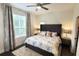 Bright bedroom with king-size bed and window coverings at 5310 Escena Ct, Tampa, FL 33611