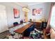 Elegant dining room with wood table, blue chairs, and wine storage at 5310 Escena Ct, Tampa, FL 33611