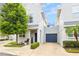 Front view of townhouse with a two-car garage at 5310 Escena Ct, Tampa, FL 33611