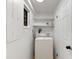 Laundry room with washer, dryer, and shelving at 3805 14Th S Ave, St Petersburg, FL 33711