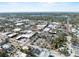 Aerial view highlighting downtown area close to waterfront, and a mix of commercial buildings and greenery at 541 E Lime St, Tarpon Springs, FL 34689