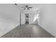 This bedroom has modern floors, closet and a view into another room at 541 E Lime St, Tarpon Springs, FL 34689