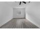 Bedroom with gray-tone vinyl floors and a unique glass block window at 541 E Lime St, Tarpon Springs, FL 34689