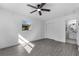 Bedroom with hardwood floors, ceiling fan, closet and a bathroom at 541 E Lime St, Tarpon Springs, FL 34689