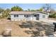 Charming home with a freshly painted exterior, landscaped yard, and a new roof at 541 E Lime St, Tarpon Springs, FL 34689
