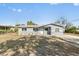 Charming home with a freshly painted exterior, landscaped yard, and a new roof at 541 E Lime St, Tarpon Springs, FL 34689