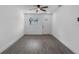 Cozy living room features modern gray flooring, natural light, and white walls at 541 E Lime St, Tarpon Springs, FL 34689