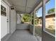 Covered patio featuring concrete flooring and views of the fenced yard at 541 E Lime St, Tarpon Springs, FL 34689
