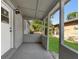 Covered patio featuring concrete flooring and views of the fenced yard at 541 E Lime St, Tarpon Springs, FL 34689