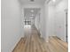 Bright hallway showcases clean lines and leads to a spacious living area, enhancing the modern feel at 2719 Winding Creek Trl, North Port, FL 34289