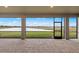 Spacious screened-in patio offers serene lake views, creating a peaceful outdoor living space at 2719 Winding Creek Trl, North Port, FL 34289