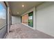 Charming covered patio featuring brick pavers, offering a seamless transition to indoor living at 2719 Winding Creek Trl, North Port, FL 34289