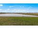 Scenic view of a serene pond surrounded by lush greenery, perfect for nature lovers at 2719 Winding Creek Trl, North Port, FL 34289