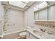 Bathroom features a shower/tub combo, vanity with sink, and tiled backsplash at 11200 102Nd Ave # 33, Seminole, FL 33778