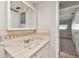 Bathroom with a vanity, sink, and medicine cabinet; view of bedroom at 11200 102Nd Ave # 33, Seminole, FL 33778