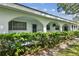 White building exterior with arched entryways and lush landscaping at 11200 102Nd Ave # 33, Seminole, FL 33778