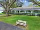 White building exterior with arched entryways and a manicured lawn at 11200 102Nd Ave # 33, Seminole, FL 33778