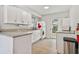 Efficient kitchen with white cabinets and granite countertops at 11200 102Nd Ave # 33, Seminole, FL 33778