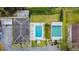 Overhead view of the community pool, shuffleboard courts, and parking lot at 11200 102Nd Ave # 33, Seminole, FL 33778