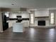 Open-concept kitchen and living area with modern finishes and ample natural light at 6969 Oldgate Cir, New Port Richey, FL 34655