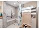 Walk-in shower with grab bars and a built-in seat offers accessibility at 9125 39Th N Ln, Pinellas Park, FL 33782