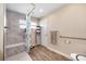 Updated bathroom with a walk-in shower, grab bars, and linen storage at 9125 39Th N Ln, Pinellas Park, FL 33782