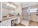 Updated bathroom features a walk-in shower with a built-in seat and modern vanity at 9125 39Th N Ln, Pinellas Park, FL 33782
